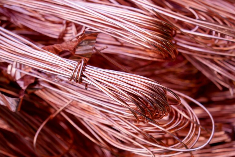 Detailed view of copper wires showcasing metallic texture and recycling theme.